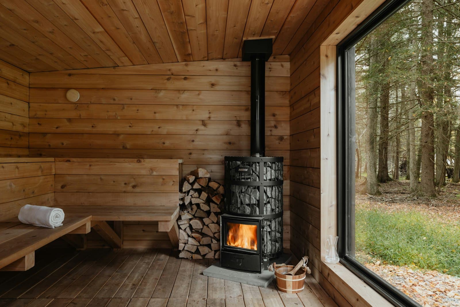 Wood-fired cabin sauna with a forest view, the kind of outdoor sauna popping up across Ireland